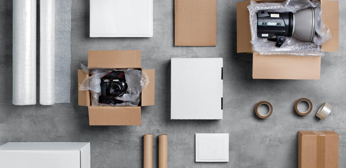 Parcels with carious content and packaging lying on a table